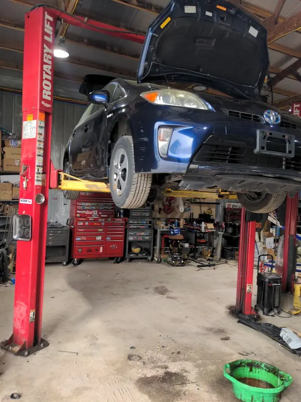 Toyota Prius on a lift for shop service at CKP Auto Repair